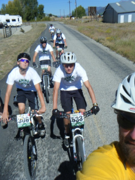 Coach Chad Cheeney leads out a pre race warm up with the 6th place Animas High Ospreys in Nathrop, Colorado