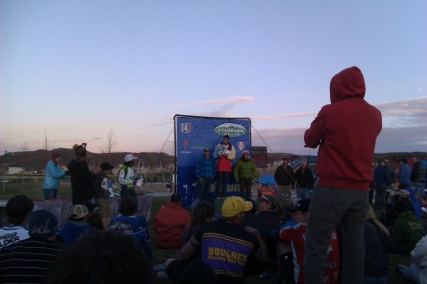 Elliott, Henry and Coach Sarah receive their 2nd Place trophy.