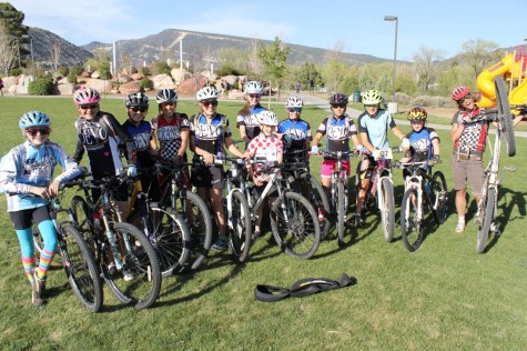 The U14 girls get new tyres and learn how to change a flat at practice.