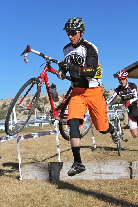 Devo U14 Coach Mint runs the barriers in Aztec this past weekend. Mint won the B category race last weekend in Durango and now has moved up to the A category. He placed well in Aztec, but might not enjoy this pic of him running with his bike.